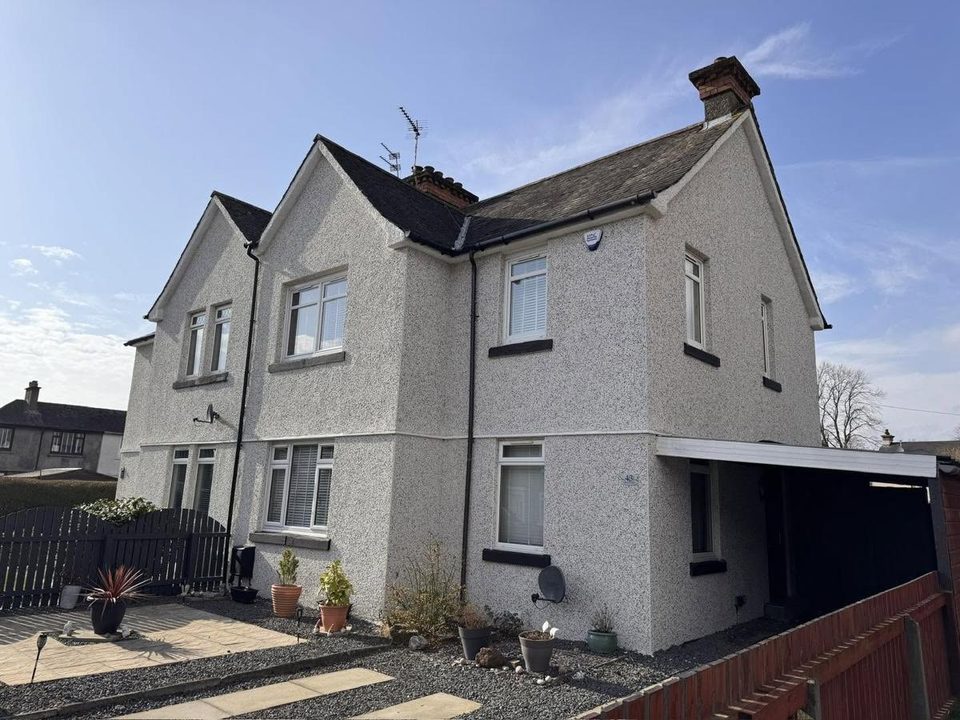 Painted brick and old roughcast taken to white and black dash
