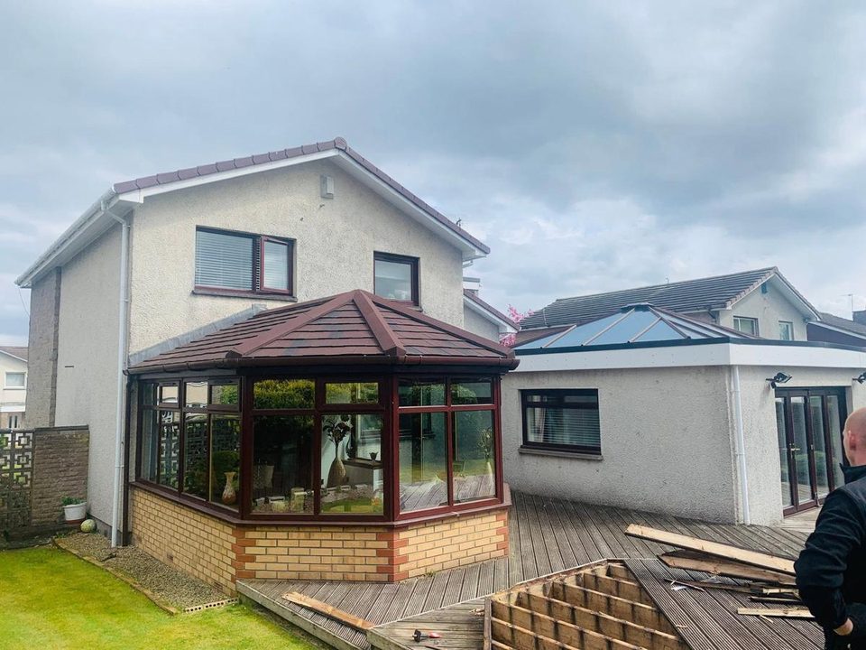 Detached house re-dashed, with a new conservatory base