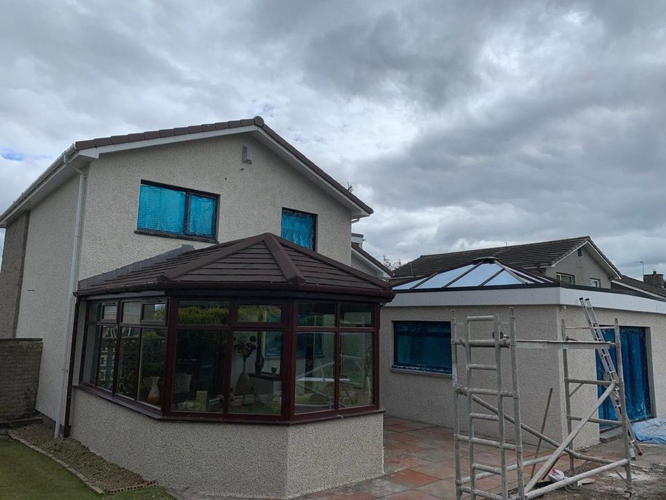 Detached house re-dashed, with a new conservatory base, before we started