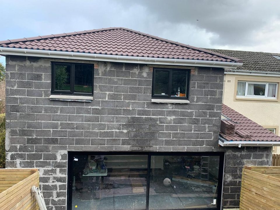 Two storey extension: blockwork, scratch coat, finished roughcast, before we started