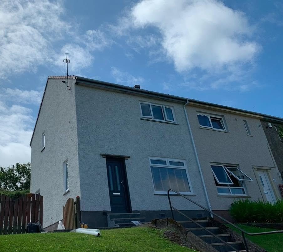 End terrace re-roughcast in light grey