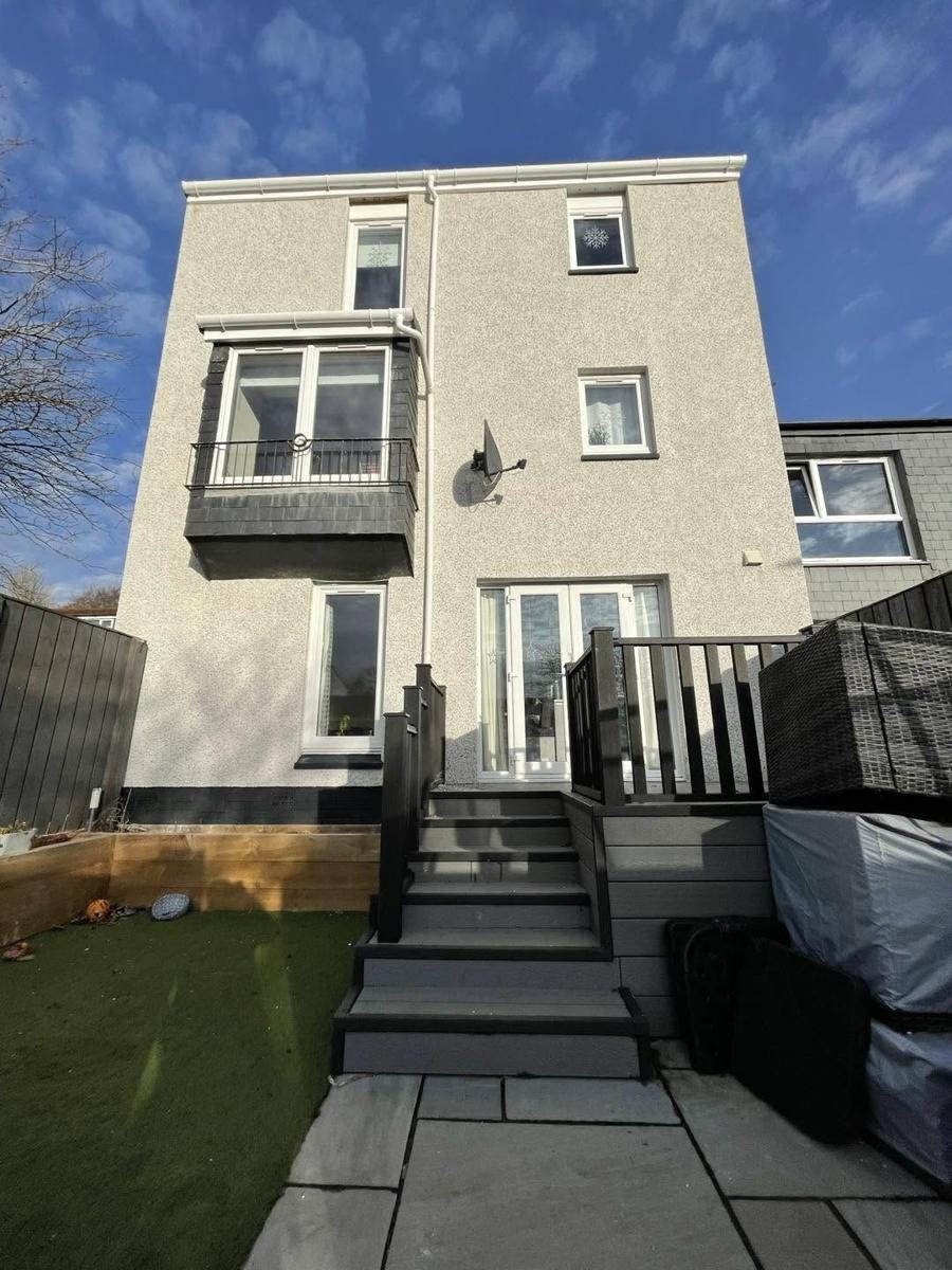 Three storey townhouse re-dashed in white, finished