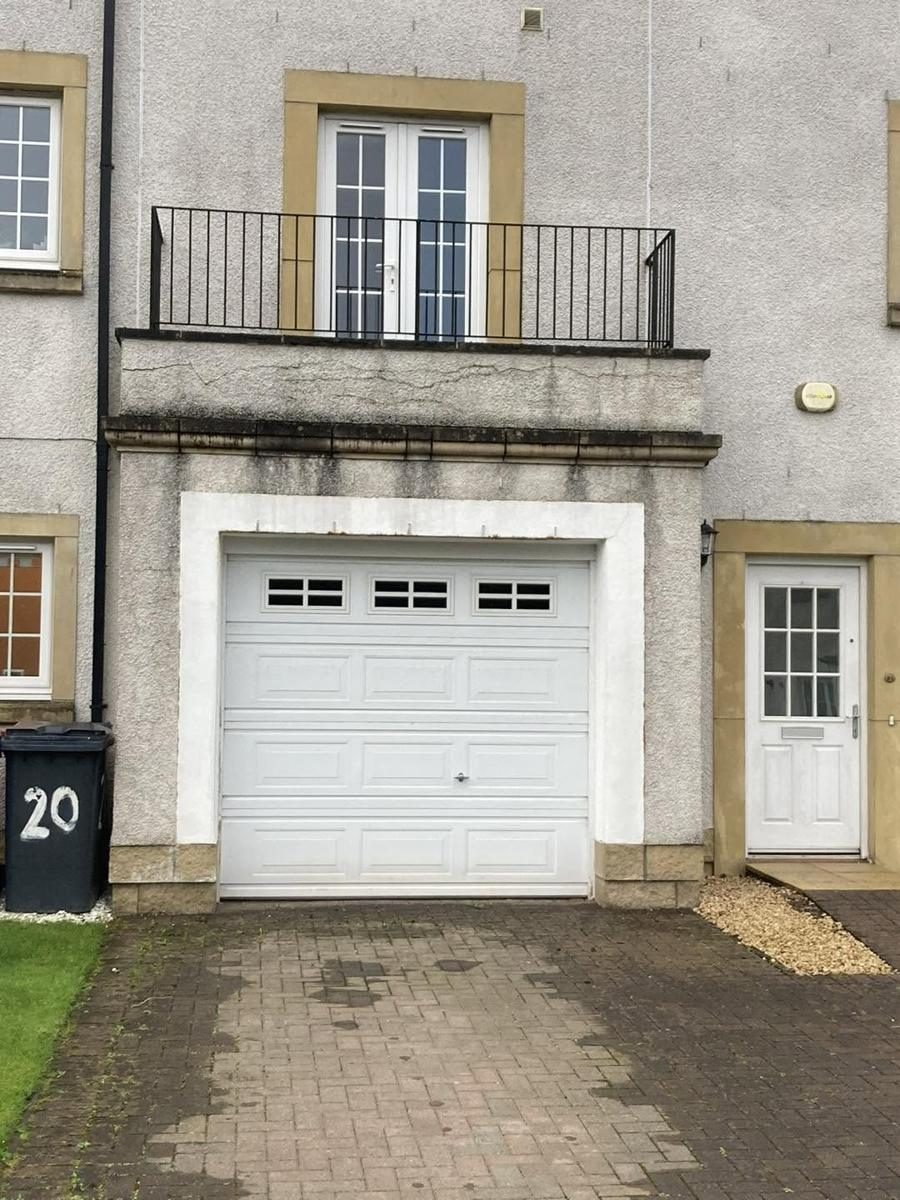 Failed render round a garage and balcony put right, before we started