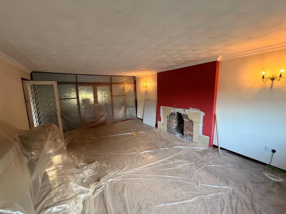 Artex ceiling and chimney breast skimmed flat, before we started
