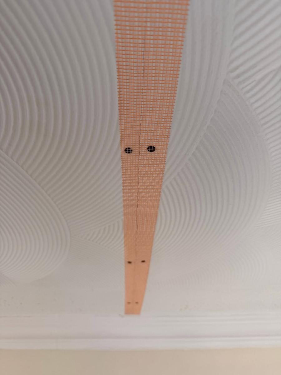 Artex ceiling and chimney breast skimmed flat, during the work