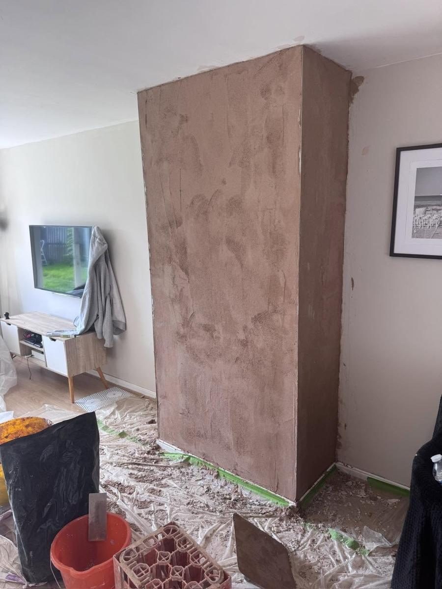 Stone effect cladding removed, chimney breast skimmed