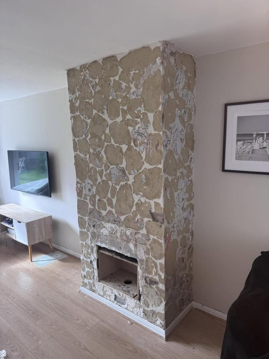 Stone effect cladding removed, chimney breast skimmed, before we started