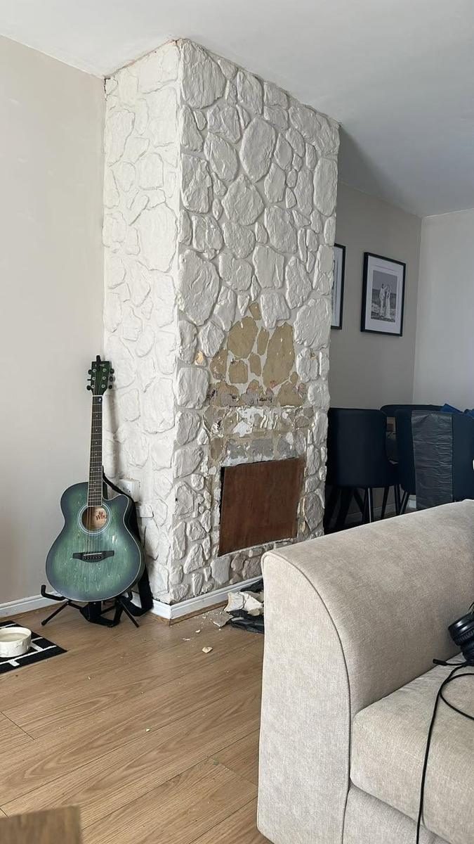 Stone effect cladding removed, chimney breast skimmed, before we started