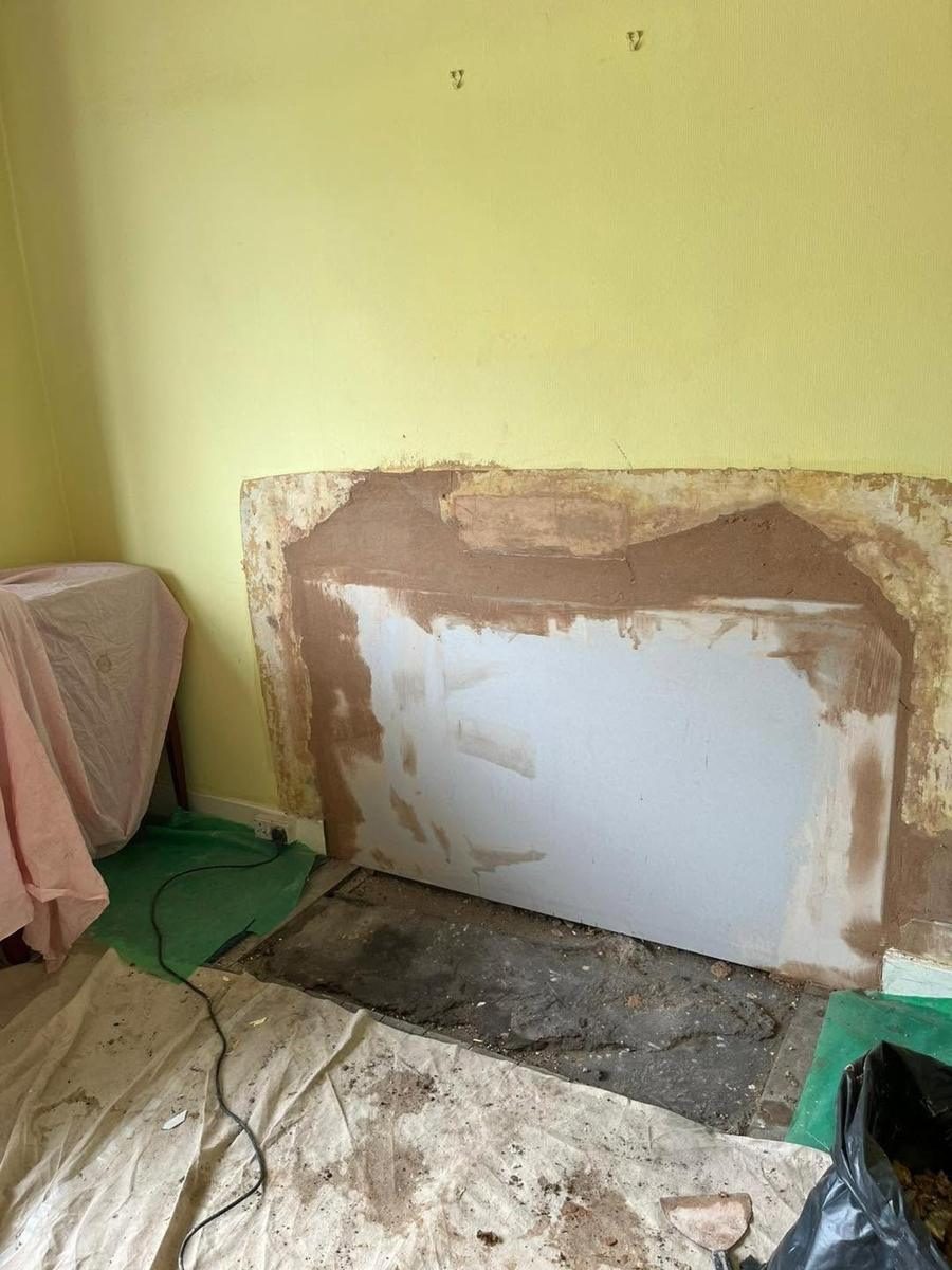 Opened chimney breast boarded and skimmed, during the work
