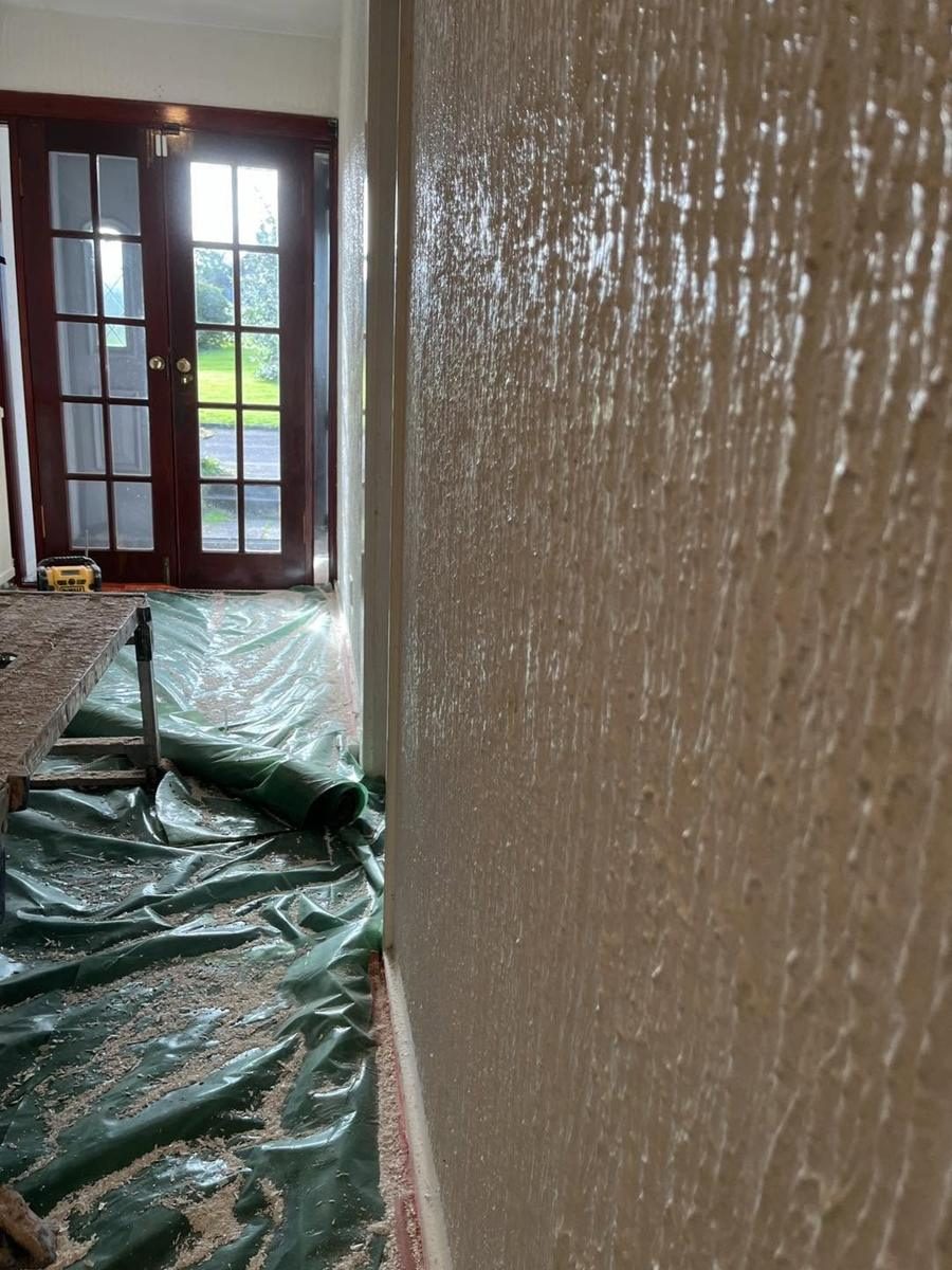 Textured hallway walls skimmed smooth, before we started